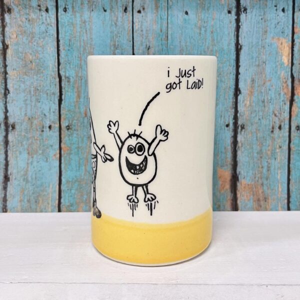 Handmade ceramic tumbler featuring original drawing by Erik Haagensen. Adult egg asking small egg about his distinct lack of shorts. The small egg informing him that he just got laid