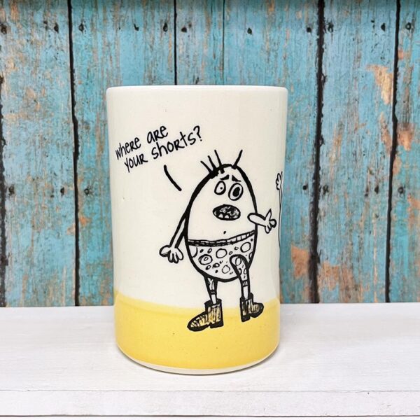 Handmade ceramic tumbler featuring original drawing by Erik Haagensen. Adult egg asking small egg about his distinct lack of shorts. The small egg informing him that he just got laid